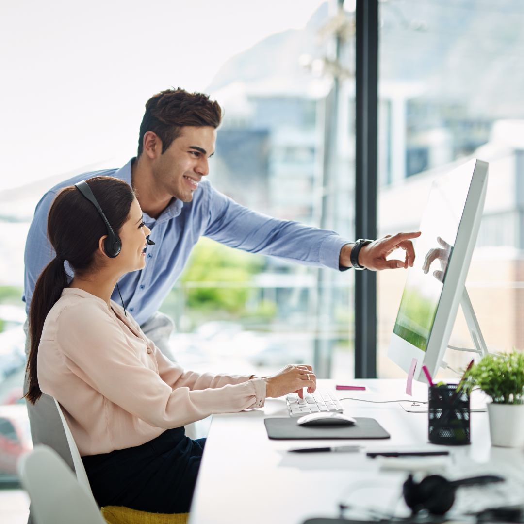 Man and women at a computer screen learning something new